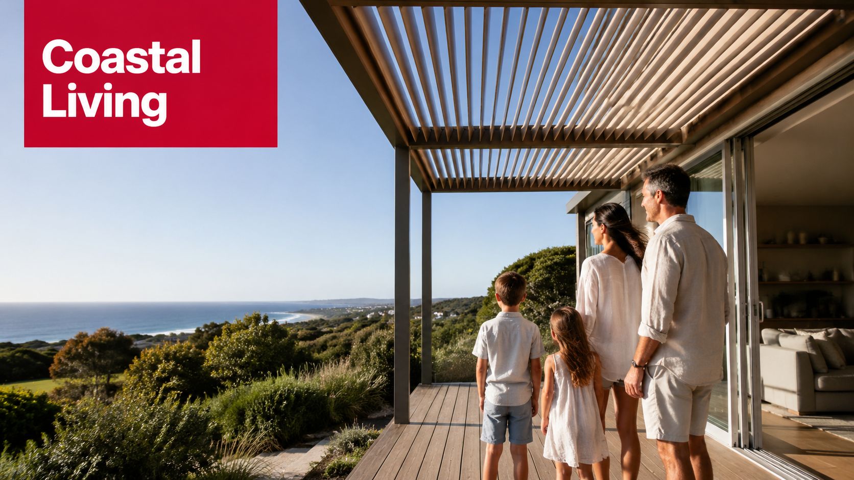 A family stands on a modern wooden deck under a pergola, enjoying a beautiful coastal ocean view.